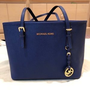 Michael Kors medium blue tote bag.